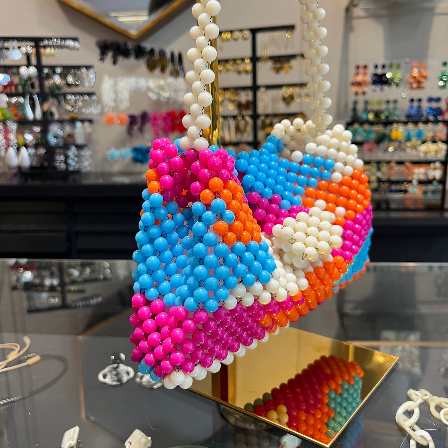 Bolso combinado tramado de resina naranja y fucsia