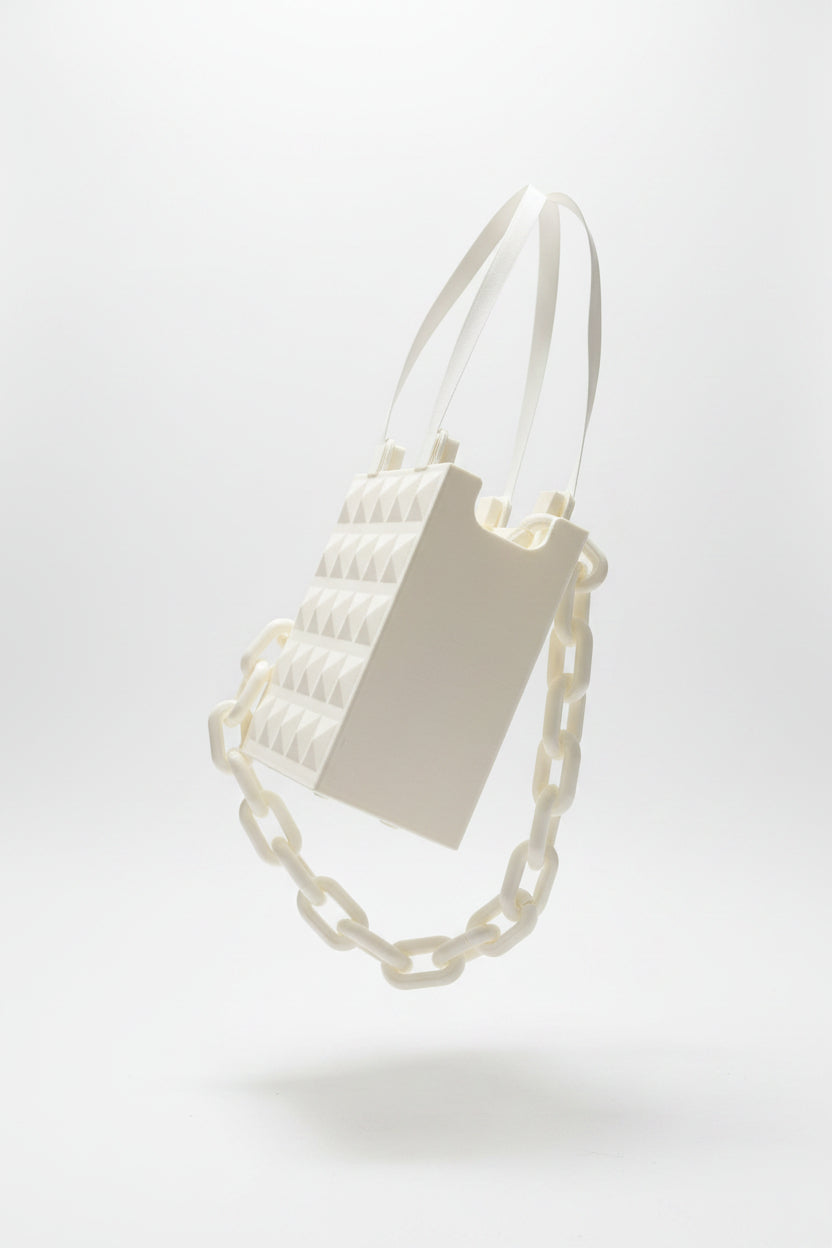 Bolso blanco tachas