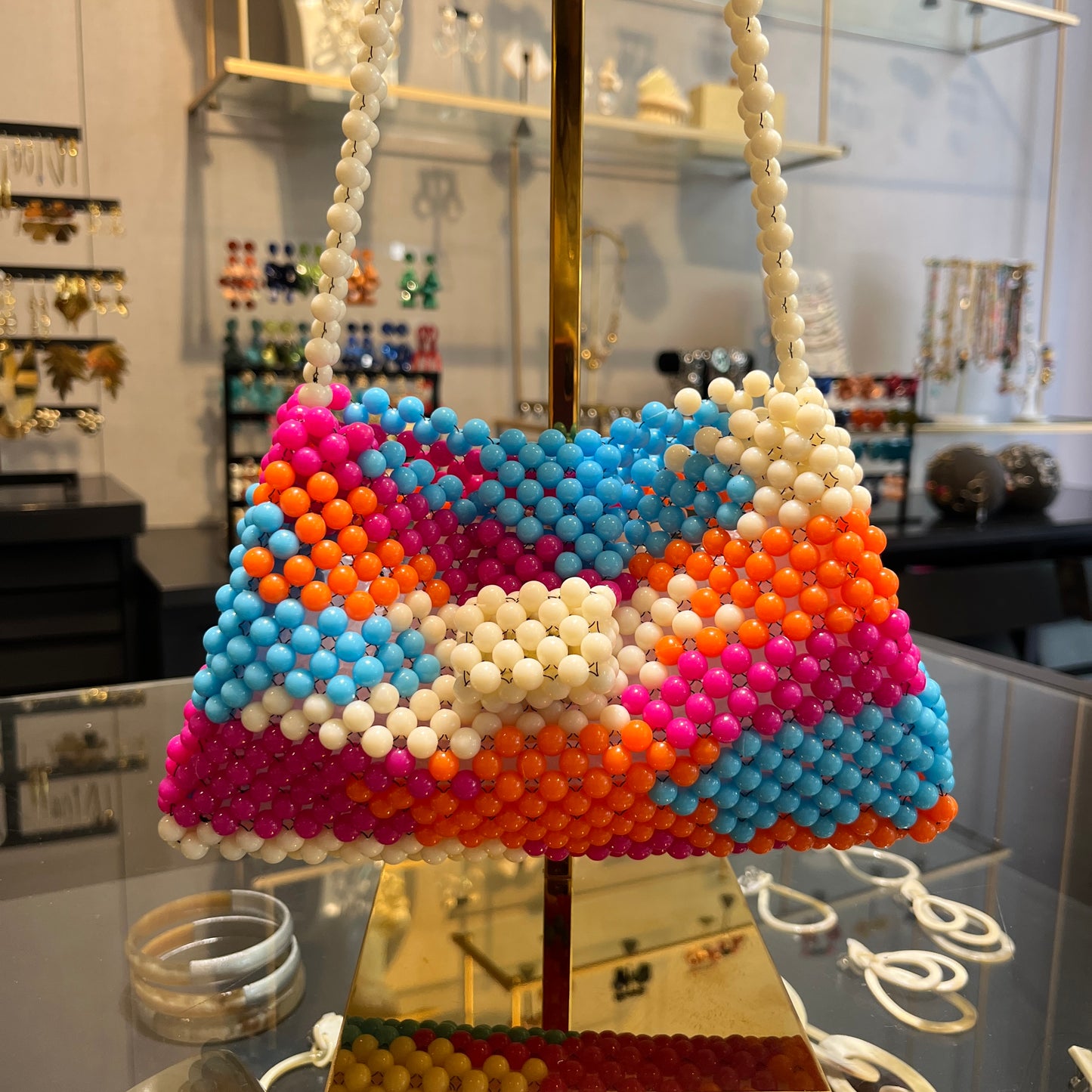 Bolso combinado tramado de resina naranja y fucsia