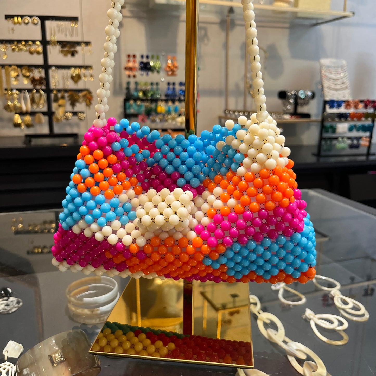 Bolso combinado tramado de resina naranja y fucsia