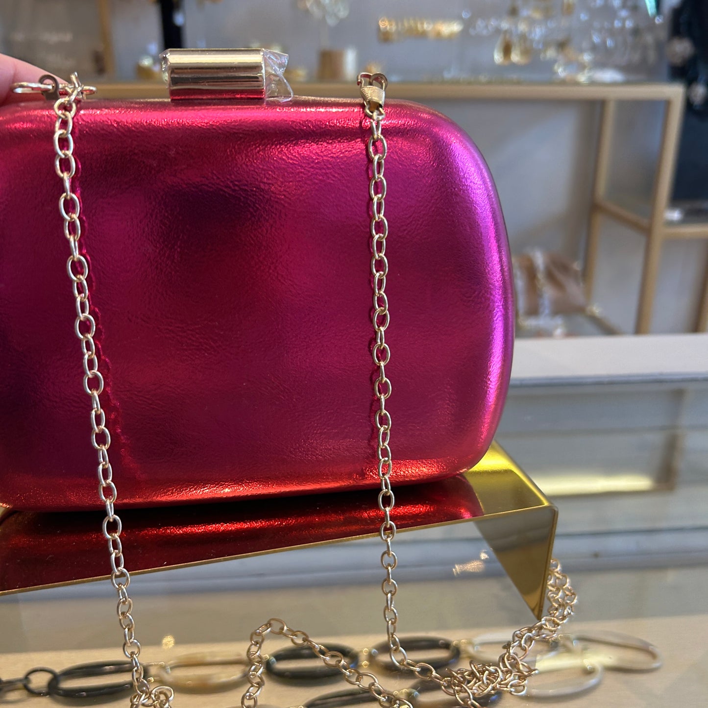 Clutch fucsia metalizado
