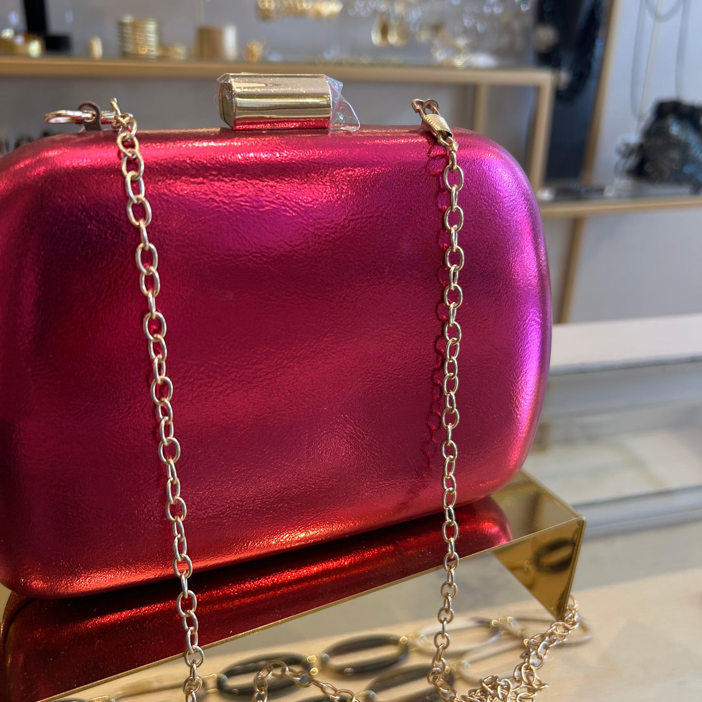 Clutch fucsia metalizado