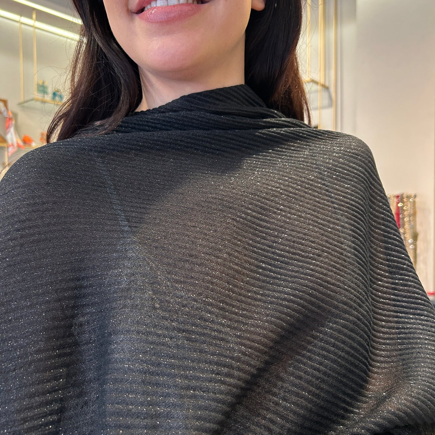 Poncho lurex plisado