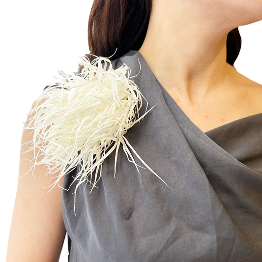 Broche de flecos