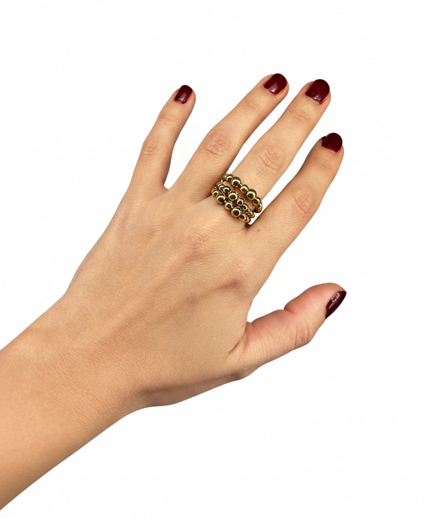 anillo esferas doradas 