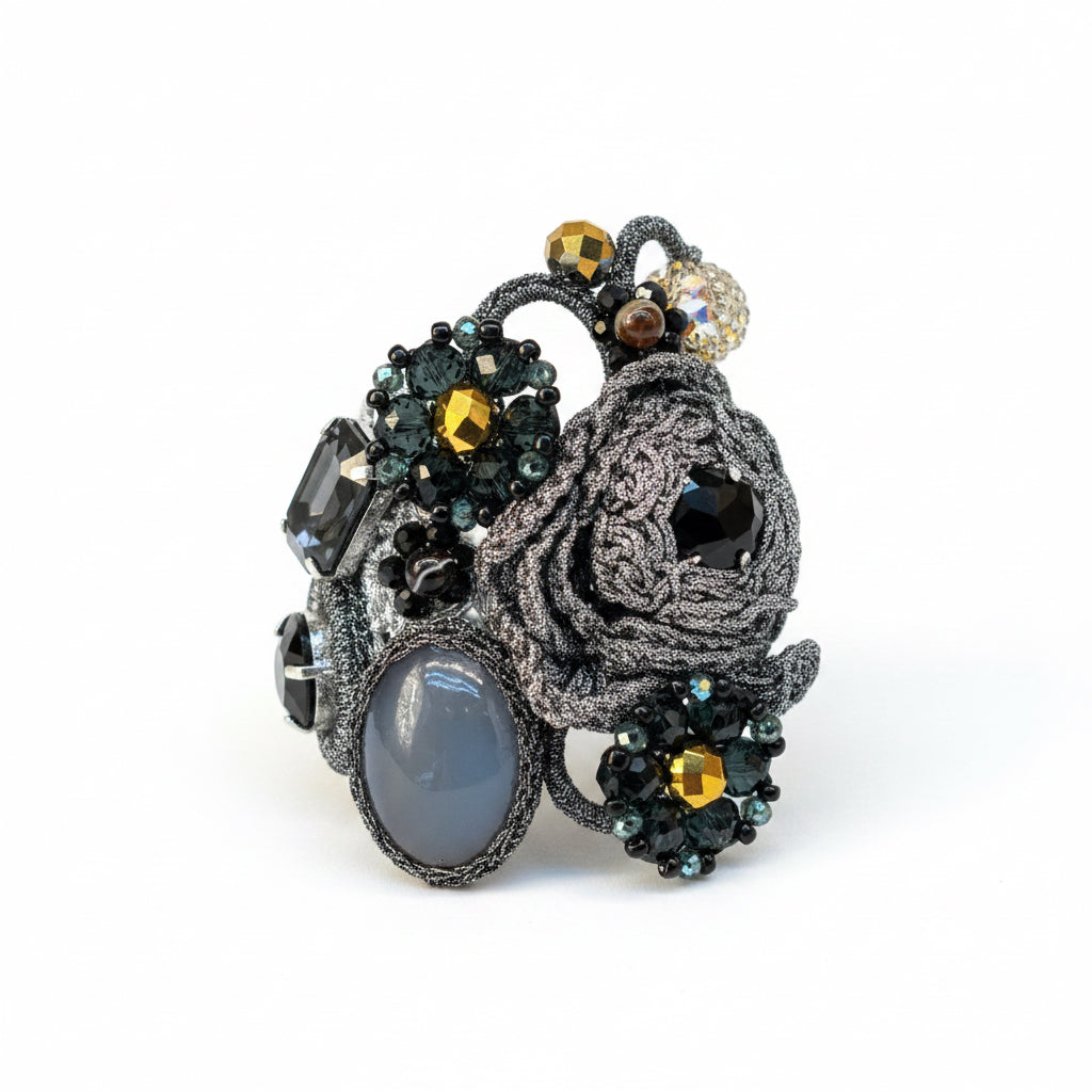 Pulsera gris, dorado  y  negro