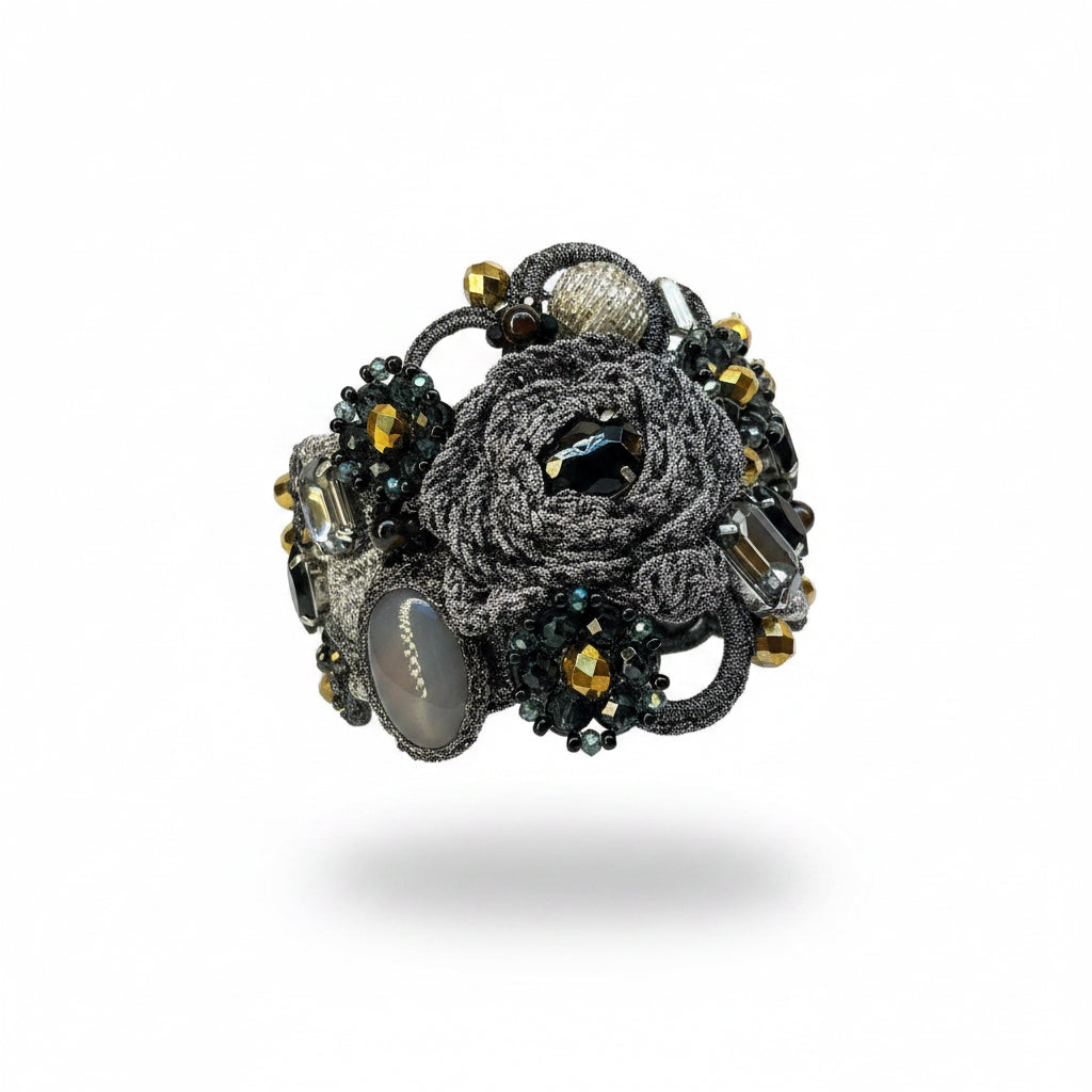 Pulsera gris, dorado  y  negro