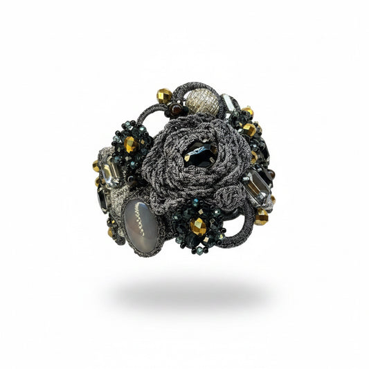 Pulsera gris, dorado  y  negro